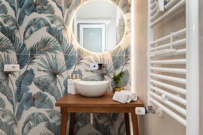 a bathroom with a sink and a mirror at Vatican Lovely Nights-Luxury Rooms in Rome