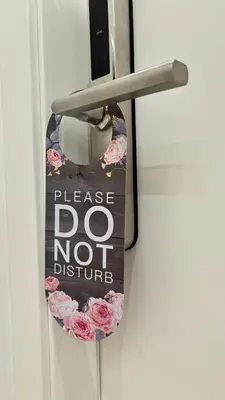 a do not disturb sign on a door handle at Vatican Lovely Nights-Luxury Rooms in Rome