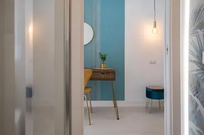 a room with a desk and a table with a chair at Vatican Lovely Nights-Luxury Rooms in Rome