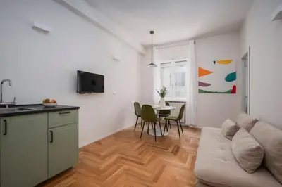 a living room with a couch and a table at Palazzo Piazza Cavour-ZEN62 in Rome