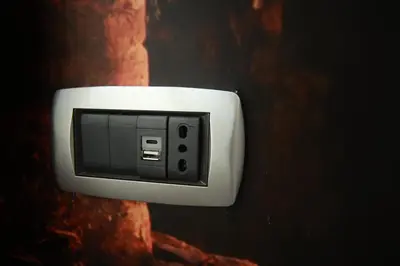 a lightswitch hanging on a wall at Vacanze Romane Vaticano in Rome