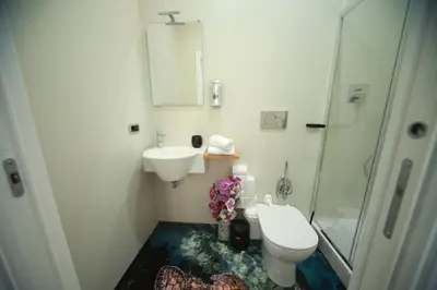 a bathroom with a sink and a toilet and a shower at Vacanze Romane Vaticano in Rome