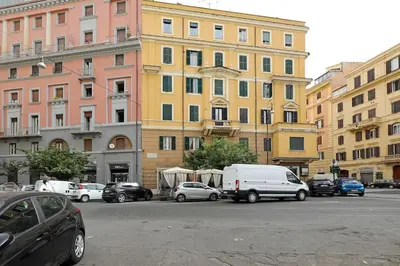 a group of cars parked in front of buildings at Jubilee Penthouse by Nosdom Properties in Rome