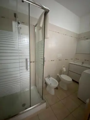 a bathroom with a shower and a toilet and a sink at Fall in love with Roma Vaticano - 5 Minutes from the Vatican - balcony with a view in Rome