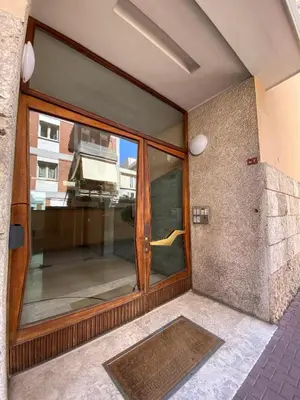a large glass door on a building with a window at Fall in love with Roma Vaticano - 5 Minutes from the Vatican - balcony with a view in Rome