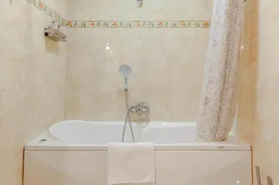 a bathroom with a bath tub and a shower at Modern & Cozy Double Rooms, Private bath WIFI AC in Rome