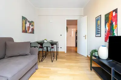 a living room with a couch and a table at Casa Acaia by Hili in Rome