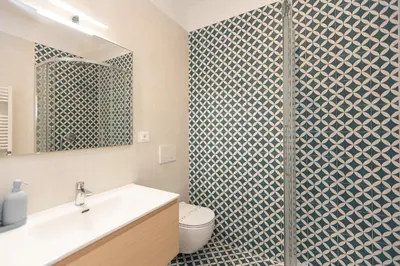 a bathroom with a shower with a toilet and a sink at Mastai Trastevere Home by Rental in Rome in Rome