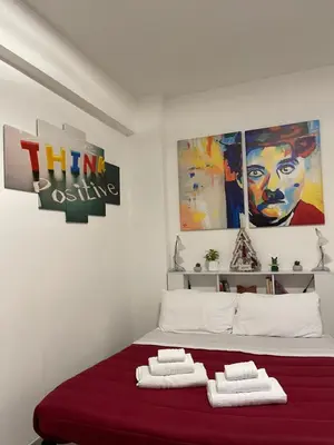 a bedroom with a bed with two towels on it at Smart Home - Trilocale con Parcheggio Privato in Rome