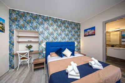 a hotel room with two beds and a bathroom at Perla al Pigneto Bed and Breakfast Roma in Rome