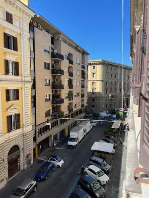 a view of a city street with parked cars and buildings at Anna Rome Vatican Luxury in Rome