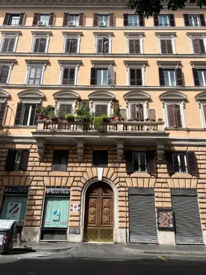 a large building with a door and a balcony at Anna Rome Vatican Luxury in Rome