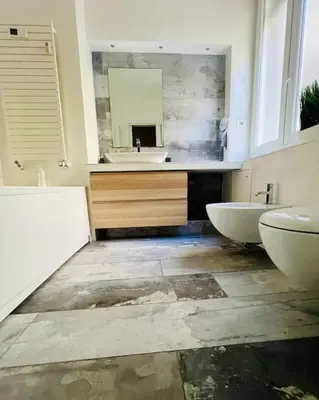 a bathroom with two sinks and a mirror at Anna Rome Vatican Luxury in Rome