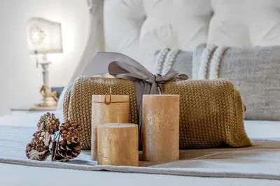 a pile of christmas gifts sitting on a bed at Trevi Fountain Elegant Apartment in Rome