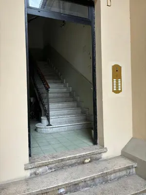 a set of stairs in a window of a building at Alba Terrace - Rome Modern Apt Close to Metro in Rome