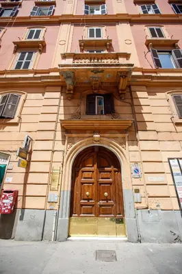 a building with a large wooden door in front at Vatican Roof Luxury Tiffany terrasse privée in Rome