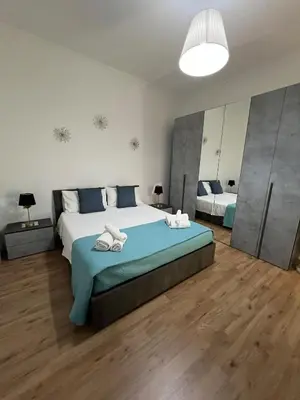 a bedroom with a large bed with towels on it at Vatican Roof Luxury Tiffany terrasse privée in Rome