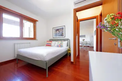 a bedroom with a bed in a room at YCH-Modern flat with terrace near Eataly in Rome