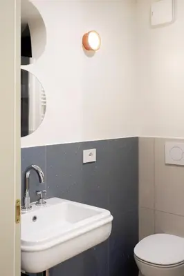 a bathroom with a sink and a toilet at La Corte Dei Panni in Rome