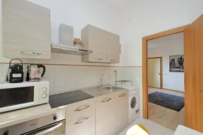 a kitchen with a sink and a microwave at Parioli Apartment self check in in Rome
