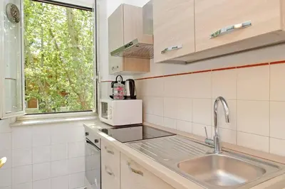 a kitchen with a sink and a window at Parioli Apartment self check in in Rome