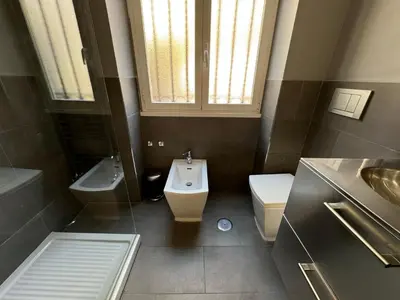 a bathroom with a sink and a toilet and a sink at House Garden 44 - 15 minutes from Vatican Museums in Rome