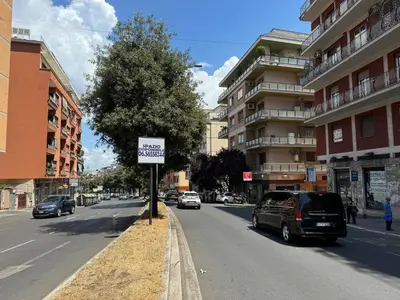 a street with cars parked on the side of the road at House Garden 44 - 15 minutes from Vatican Museums in Rome