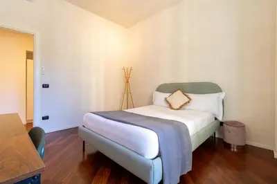 a bedroom with a bed with a pillow on it at Apartment Next to St Peter in Rome