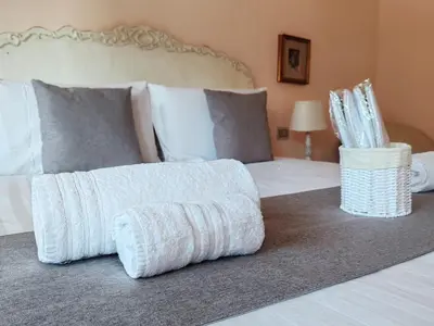a bedroom with a bed with a white blanket on it at La Dolce Vita Of Via Veneto - Prestigious Apartment With Wonderful Terrace In the Historic Center in Rome