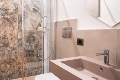 a bathroom with a shower and a sink at Maison Vaticano - A few steps from Vatican and San Peter in Rome