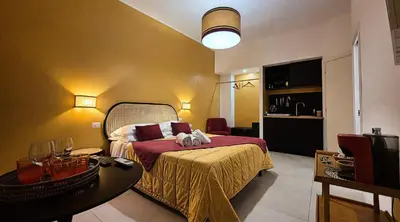 a bedroom with a bed with a red blanket at IAIO Testaccio Retrò in Rome
