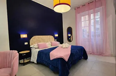 a bedroom with a large bed with towels on it at IAIO Testaccio Retrò in Rome
