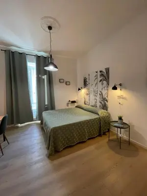 a bedroom with a bed and a table at Enjoy Rhome in Rome