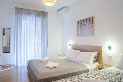 a bedroom with two beds with towels on them at VaticaNella 10 min walk from Vatican Museums in Rome
