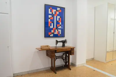 a table in a room with a painting on the wall at VaticaNella 10 min walk from Vatican Museums in Rome