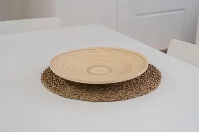 a wooden plate sitting on top of a white table at VaticaNella 10 min walk from Vatican Museums in Rome