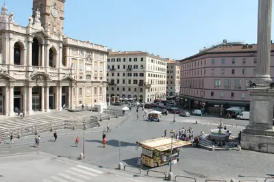 a group of people walking around a city street at Domus Maggiore in Rome