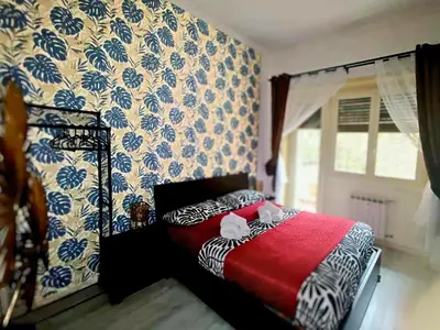 a bedroom with a bed with a red blanket at Rome Castle&Dome in Rome