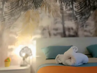 a stuffed animal sitting on top of a bed at Rome Castle&Dome in Rome