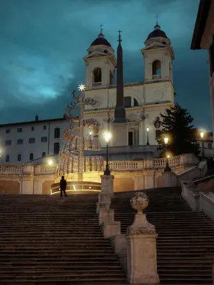 a building with a christmas tree in front of it at Hotel Azzurra in Rome