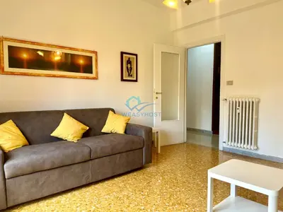 a living room with a couch and a table at Typical Grandma's Roman Apartment in Rome