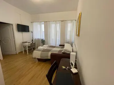 a bedroom with a bed and a desk with a computer at Charming Apartment Near Roman Forum - 60 m² in Rome