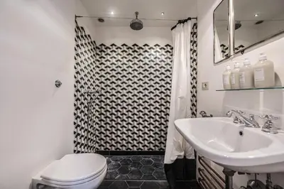 a bathroom with a shower and a toilet and a sink at Unique Garden Apartment near Caracalla Baths in Rome