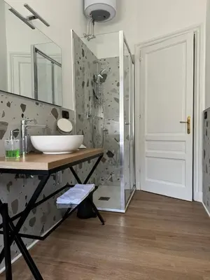 a bathroom with a sink and a shower at Casa Palmiero in Rome
