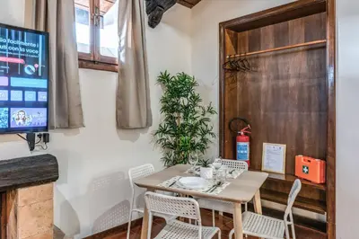a dining room with a table and chairs at Elena Vatican Apartment in Rome