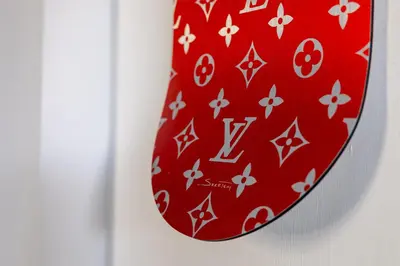 a red tie is hanging on a wall at Radio Guest House Intero Appartamento Moderno A Trastevere in Rome