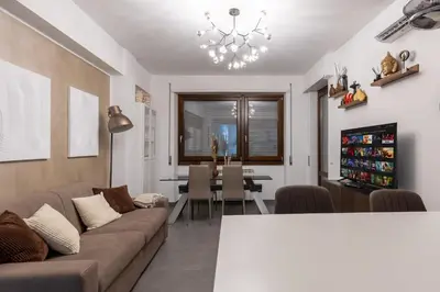 a living room with a couch and a table at Radio Guest House Intero Appartamento Moderno A Trastevere in Rome