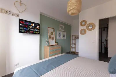 a bedroom with a bed and a tv on the wall at Radio Guest House Intero Appartamento Moderno A Trastevere in Rome