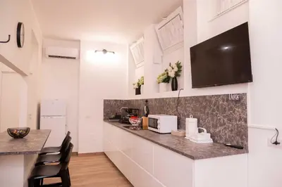 a kitchen with a counter top and a microwave at Antonella in Rome