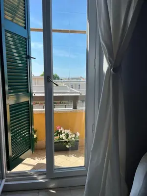 a window with a view of a balcony at Casa Roma San Giovanni in Rome